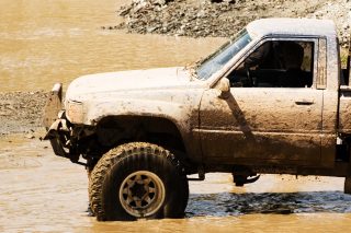 lifted 4x4 truck gettin dirty in the mud