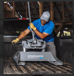 Worker employing companion hitch, perfect for commercial and recreational vehicles