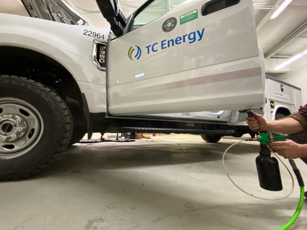 Rust protection being sprayed onto a vehicle to ensure premiere protection