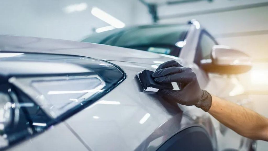 A delicate hand finishing our recreational vehicle spray-on